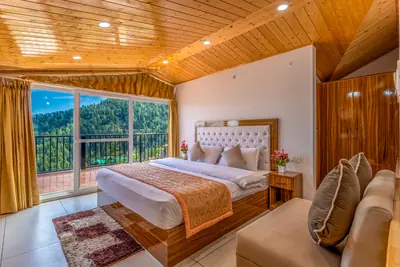 Attic suite 308, the bed and the glass to the balcony