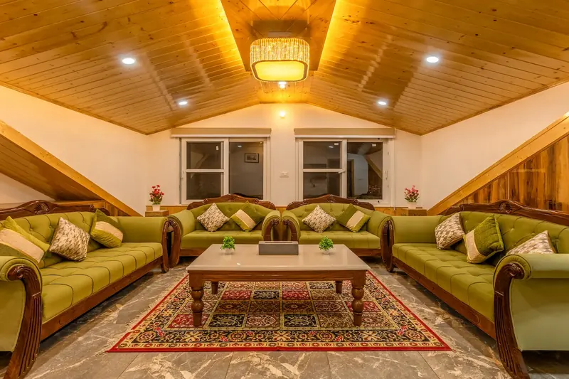 The attic lounge under the pine ceiling