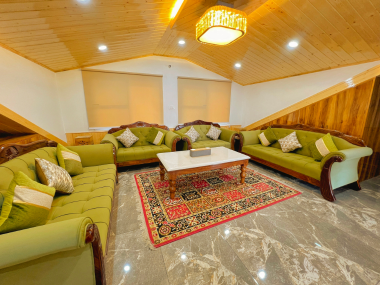 Attic suite with seating area at VAMITAG Inn